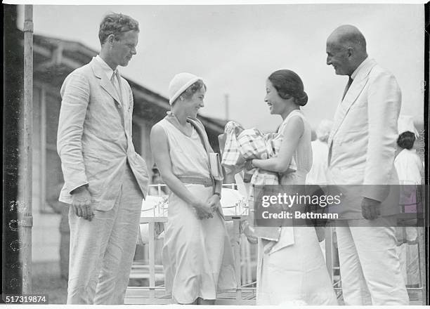 Colonel and Mrs. Charles A. Lindbergh with Dr. R.B. Teusler of the St. Luke's International Medical Center and Mrs. Yammamoto.