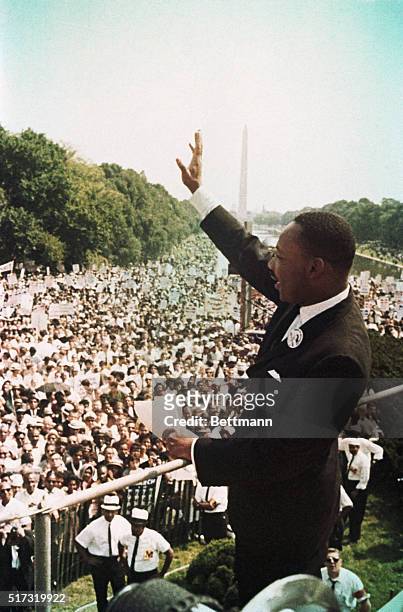 American Religious and Civil Rights leader Dr Martin Luther King Jr waves to participants in the Civil Rights Movement's March on Washington,...