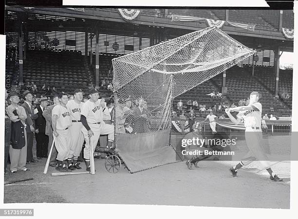 Dom DiMaggio, manager Joe Cronin and Rudy York , of the Boston Red Sox, watch slugger Ted Williams at batting practice in sportsman's Park, St....