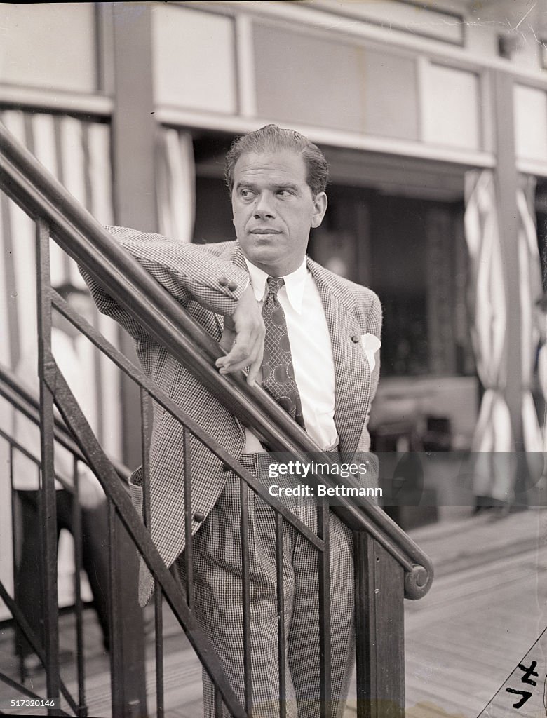 Frank Capra Leaning on Railing of Ship