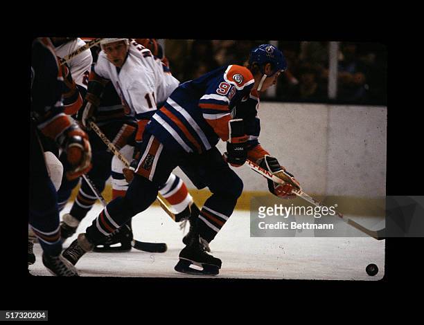 Wayne Gretzky, number 99 with the Edmonton Oilers, is shown travelling with the puck during a game with the Detroit Redwings at the Nassau Coliseum...