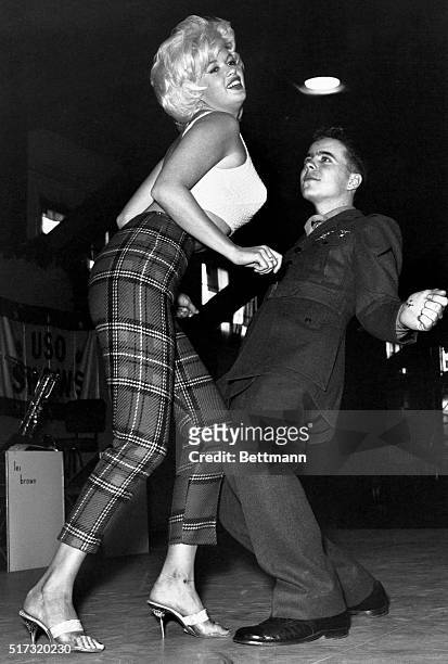 Marine Pfc. Bob Kamineki dances the twist with motion picture actress Jayne Mansfield at the U.S. Naval Station Argentia in Newfoundland, Canada....