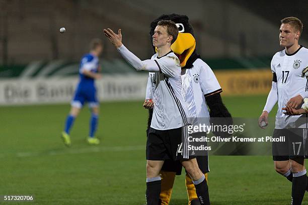 Defense Lukas Klostermann of Germany throwing chocolate eggs into the audience at Frankfurter Volksbank-Stadion during the international football...