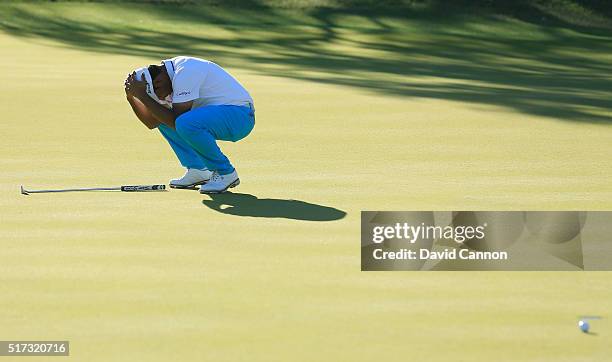 Anirban Lahiri of India reacts to a missed birdie putt on the 18th green during the second round of the World Golf Championships-Dell Match Play at...
