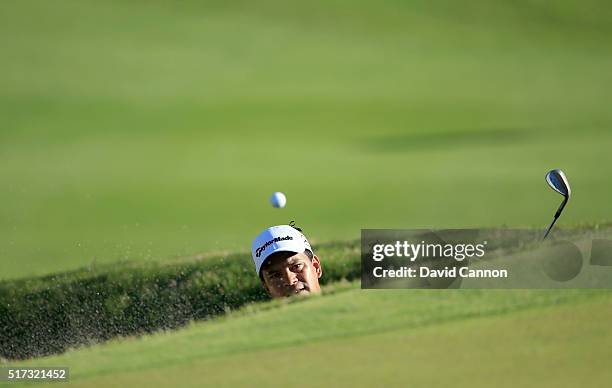 Fabian Gomez of Argentina plays his third shot from the deep bunker at the front of the 18th green in his match against Matt Kuchar during the second...