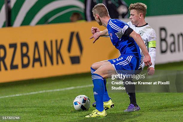 Ahri Mohr Jonsson of Faroe Islands and Midfielder Max Meyer of Germany fight for the ball at Frankfurter Volksbank-Stadion during the international...