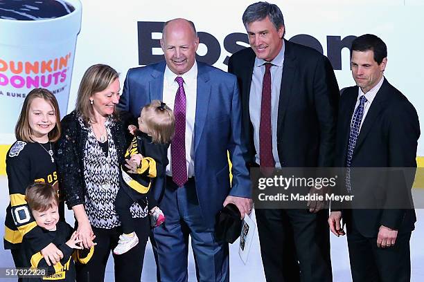 Claude Julien of the Boston Bruins, center, with wife Karen and daughters Katryna Chanel and Madyson, and son Zachary is honored by Don Sweeney,...