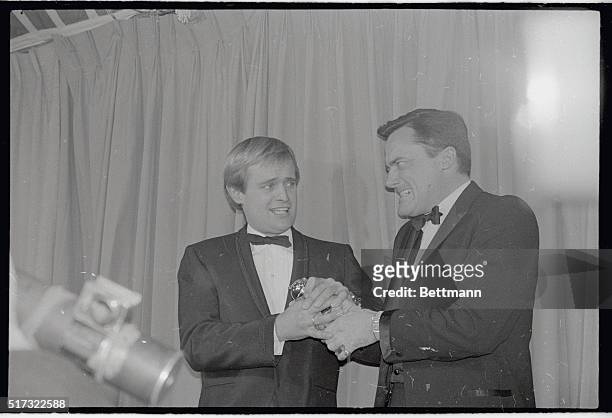The "men" from "U.N.C.L.E.," David McCallum and Robert Vaughn engage in a bit of tug of war with the Golden Globe they were awarded by the Hollywood...