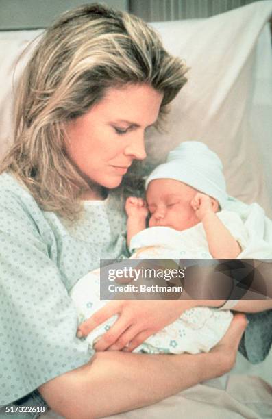 Murphy Brown, played by Candice Bergen, holds her newborn son Avery on the television show "Murphy Brown." The story generated controversy when Vice...