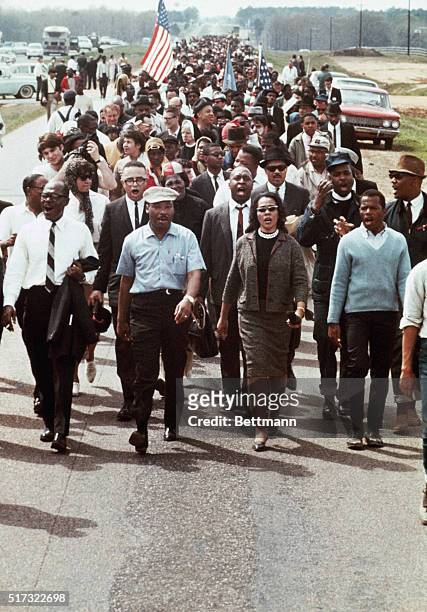 Martin Luther King, Jr. And his wife, Coretta, lead a five-day march to the Alabama State Capitol in Montgomery in 1965.