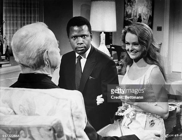 Sidney Poitier and Katherine Houghton in a scene from the movie: "Guess Who's Coming to Dinner." Movie still, 1967.
