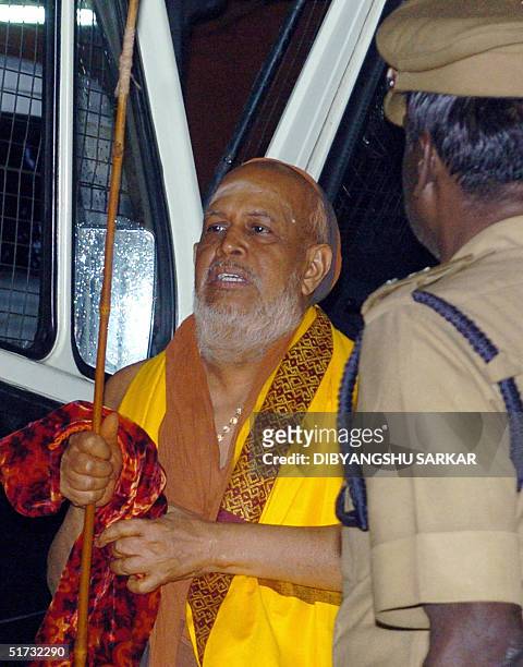 One of India's top Hindu religious leaders, Jayendra Saraswati comes out of a police van at the Judicial Magistrate's Court in the city of...