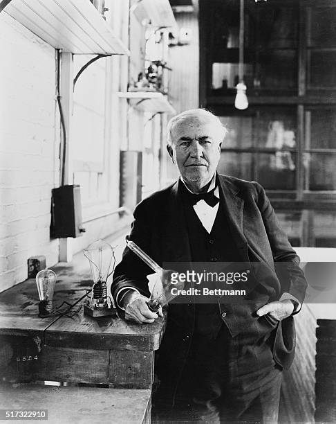Inventor Thomas Alva Edison shows the incandescent lamps he created at his Menlo Park laboratory in New Jersey. While Edison did not invent the idea...