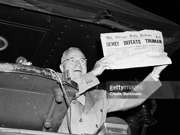 St. Louis, Mo: This photo of President Harry S. Truman laughing as he holds an early edition of the Chicago Tribune for Nov. 4th was taken by United...