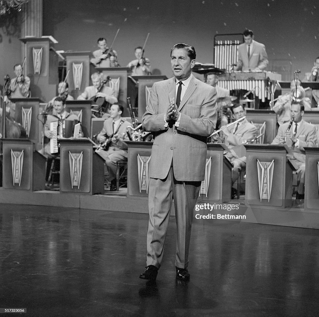 Lawrence Welk in front of the Lawrence Welk Orchestra, on the "The
