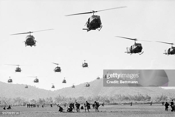 Helicopters land under heavy sniper fire near Bong Son in South Vietnam during Operation Eagle's Claw.