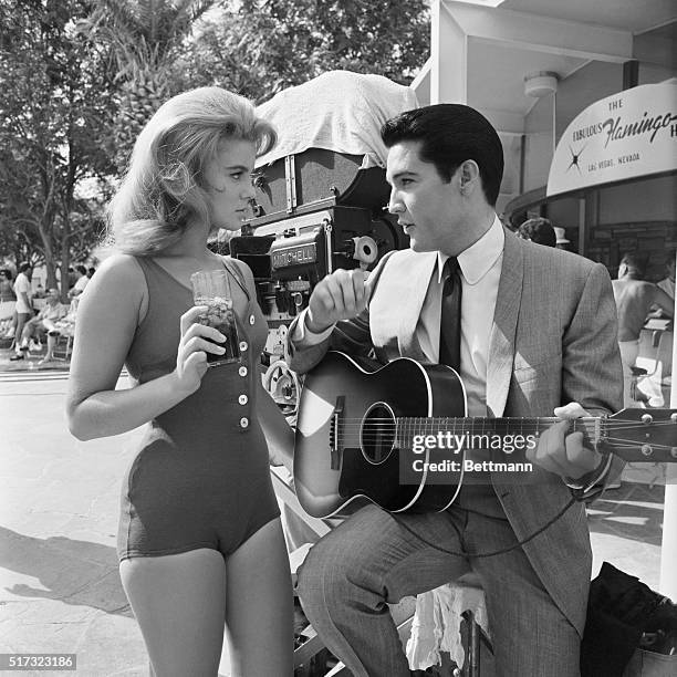 Ann-Margret and Elvis Presley rehearse the duet they are to sing in the film Viva Las Vegas.