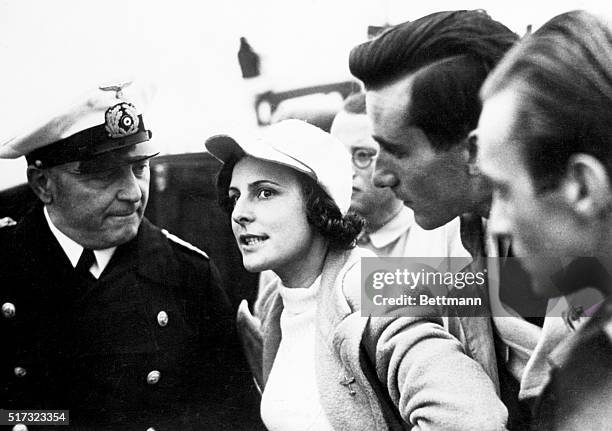 Leni Riefenstahl, the German director, gives instructions to Captain Hauck, on the set of one of her films about the 1936 Olympic games in Berlin....