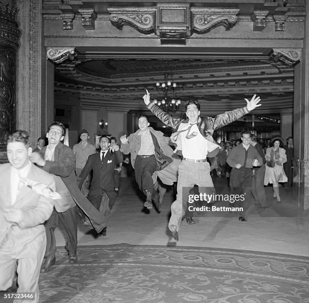 Enthusiastic fans scramble to a New York City box office, hoping for front row tickets to see Tommy Dorsey and his orchestra.