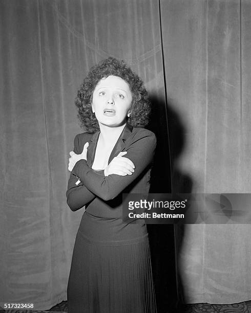 Singer Edith Piaf performs at the Versailles night club in New York City.