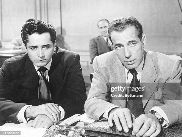 Armed only with a lawyer's briefcase, Bogart prepares to battle just with words in "Knock On Any Door." He hasn't gone too far afield, however,...