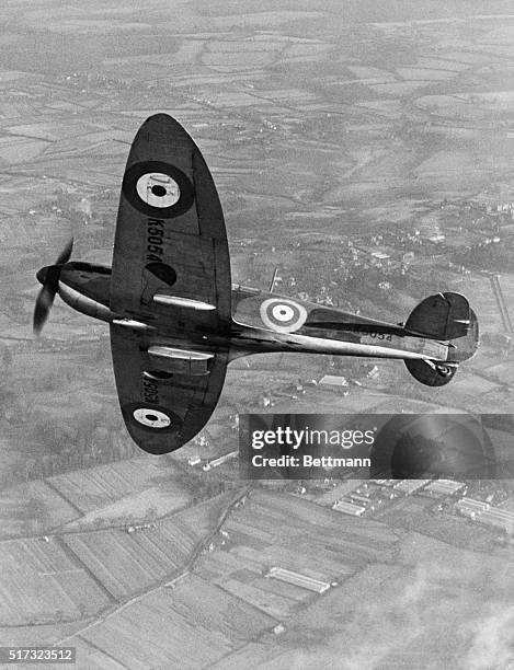 The R.J. Mitchell designed Supermarine Type 300 Prototype Spitfire interceptor fighter registration K5054 starts to bank into a turn over the English...