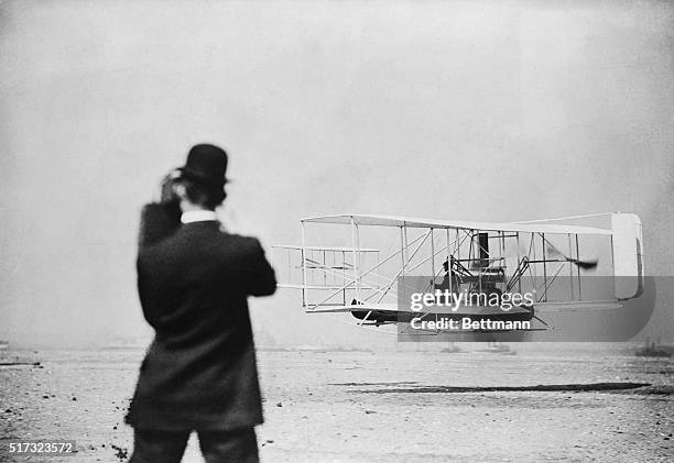 Fort Myers, FL-ORIGINAL CAPTION READS: Wilbur Wright photographs test flight of Orville at Fort Myers. ** BPA2#360 **