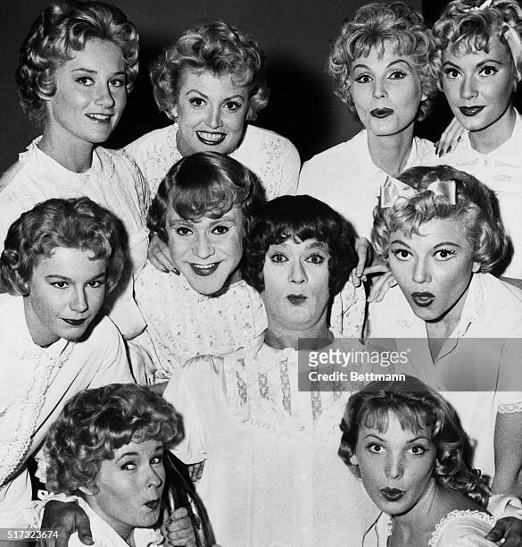 Ten pretty girls? Count again- there are only eight, plus doll in center is Tony Curtis rubbing heads with Jack Lemmon. They have to masquerade as...