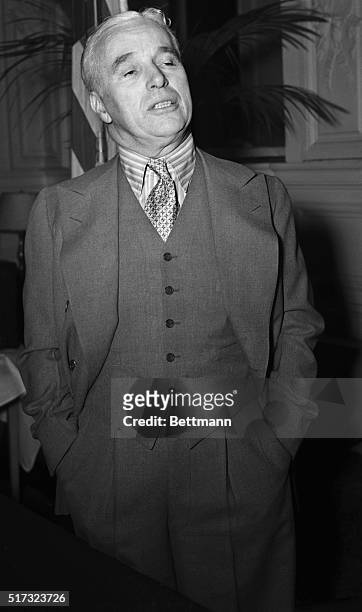 New York, NY: Charles Chaplin, veteran screen star and producer, is shown as he was interviewed by the press today at the Hotel Gotham in New York,...