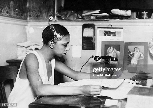 Paris, France: Photo shows Josephine Baker, the dark star ofthe Follies Bergere, as directrice of her own bar, or cabaret. She seems to be "all...