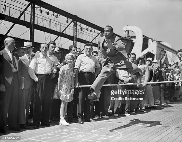 Jesse Owens practices aboard the S.S. Manhattan on the way to the Olympic games in Berlin.