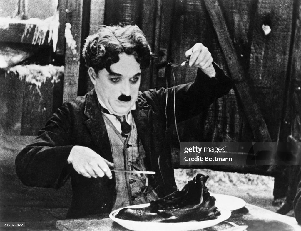 Charlie Chaplin in the Shoe-Eating Scene from The Gold Rush.