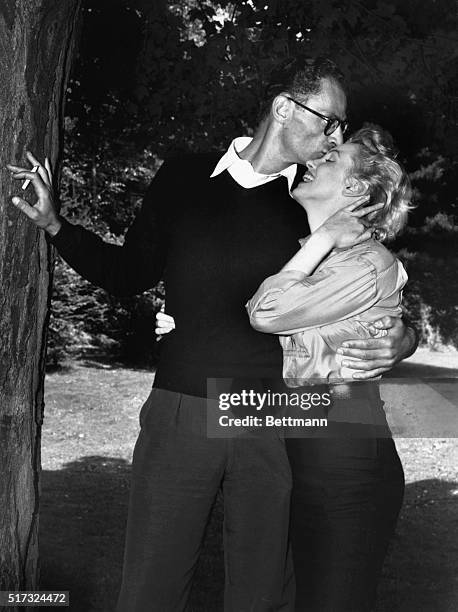 Roxbury, Connecticut: Arthur Miller kisses Marilyn Monroe on her forehead during a news conferece at Miller's summer home here, June 29th. The couple...