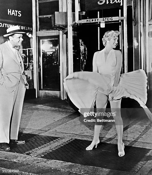 Tom Ewell and Marilyn Monroe in a scene from the movie The Seven Year Itch.