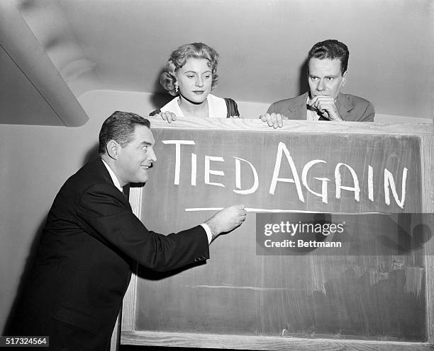 New York: Quizmaster Jack Barry underscores the fact as his two record-toppling contestants on TV's "Twenty-One" show, Mrs. Vivienne Nearing and...