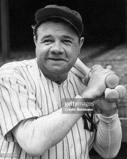 Babe Ruth , with usual warm-up bats slung over left shoulder, begins work-out for Army & Navy benefit in Yankee Stadium.