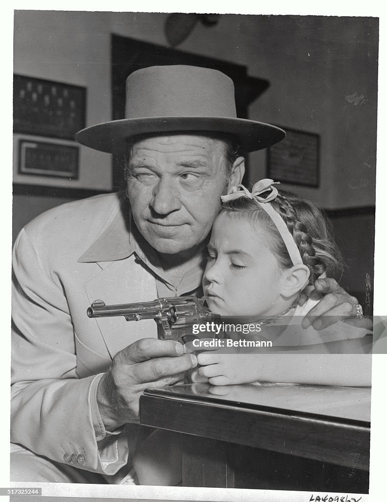 Wallace Beery with Daughter Carol Ann and Gun