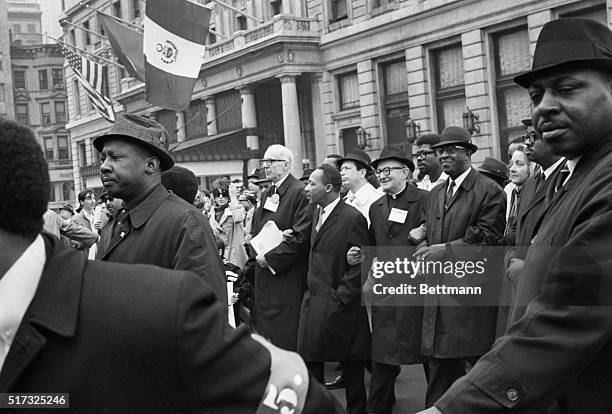 New York, NY: Walking arm-in-arm during the April 15 anti-Vietnam demonstration here are, From Left, Dr. Benjamin Spock, Martin Luther King,...