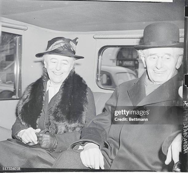 Louis Dembitz Brandeis, associate Justice of the U.S. Supreme Court, shown with Mrs. Brandeis as they left their home to attend a court meeting on...