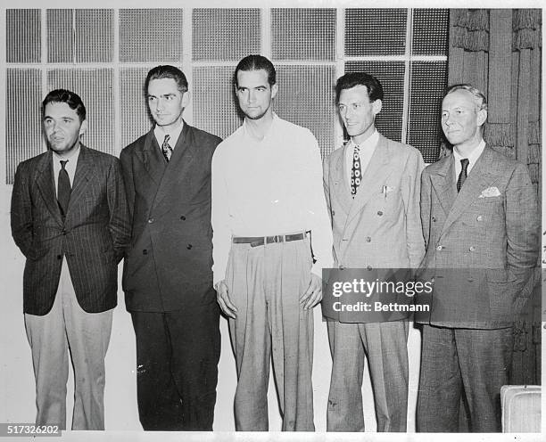 Millionaire Howard Hughes and his heroic crew, characterized by him as "the best crew in the world," pose for "just one more" picture at the home of...