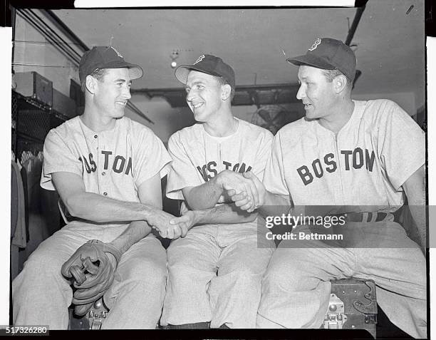 Ted Williams, , and Rudy York, , wish good luck to Boston Red Sox pitcher Mickey Harris before he took the mound to face St. Louis Cardinals in the...