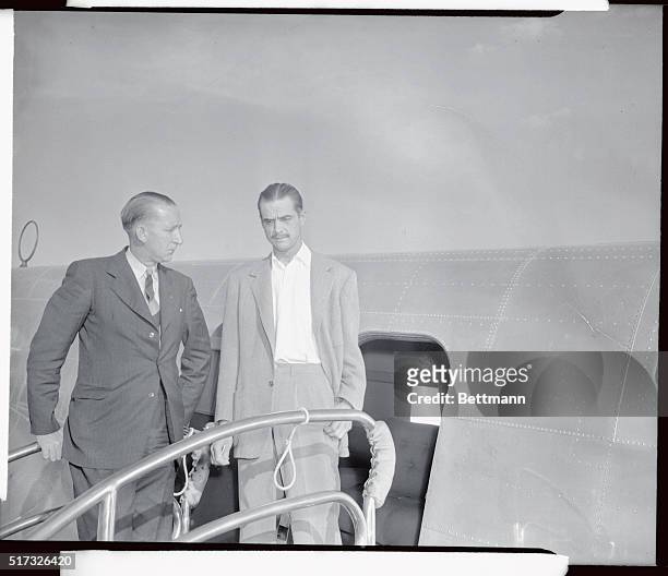 Senator Harry P. Cain, , left, member of a Senate subcommittee investigating Howard Hughes' war contracts, chats with Hughes beside his controversial...