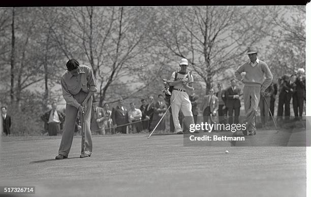 Ben Hogan, of Texas, who grabbed top money in the $5,000 Goodall Round Robin Tournament, watching Martin Pose, Argentine ace, putting on the 12th...