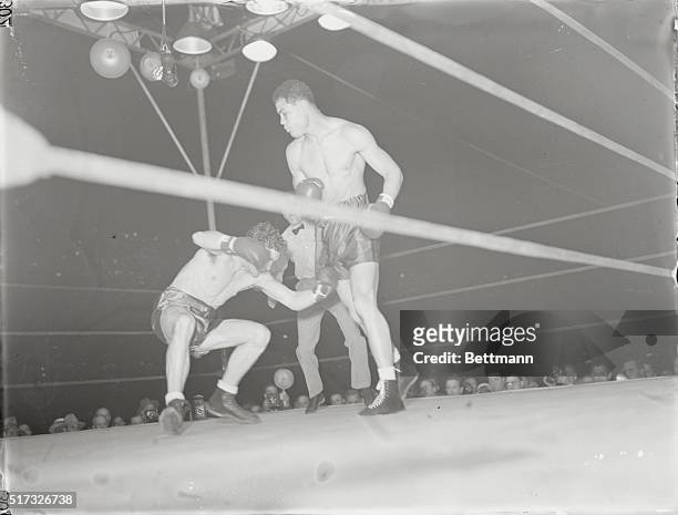 Conn Slips in First Round of Fight with Louis. New York City: Billy Conn slips and falls to the canvas in the first round of his fight with...