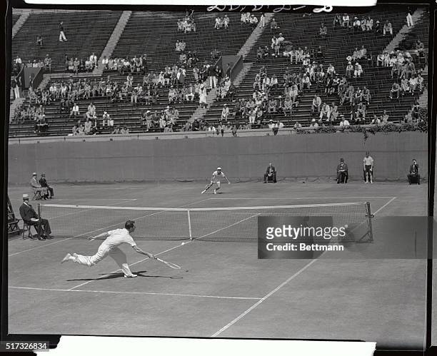 An excellent action photo was made during the quarter finals game today between Frank Parker, , No. 2 Davis Cup man, and John Van Ryn, , in the...