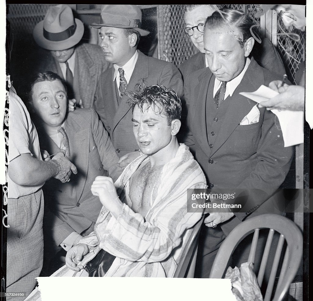 Barney Ross Examining Injured Hand