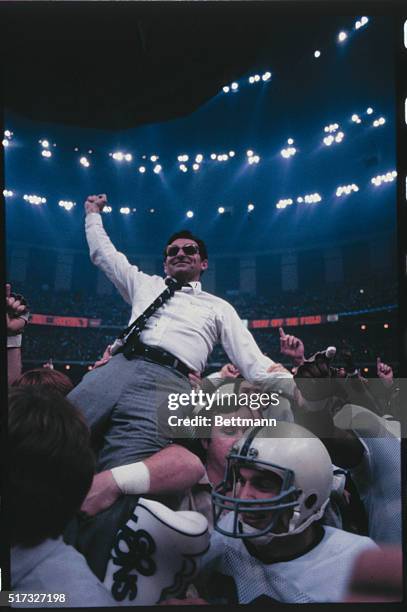 New Orleans, Louisiana: Penn State coachk, Joe Paterno, is carried off the field after Penn State defeated the University of Georgia, 27-23, at the...