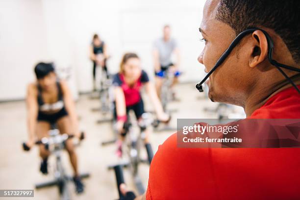 exercising class - exercise bike class stock pictures, royalty-free photos & images