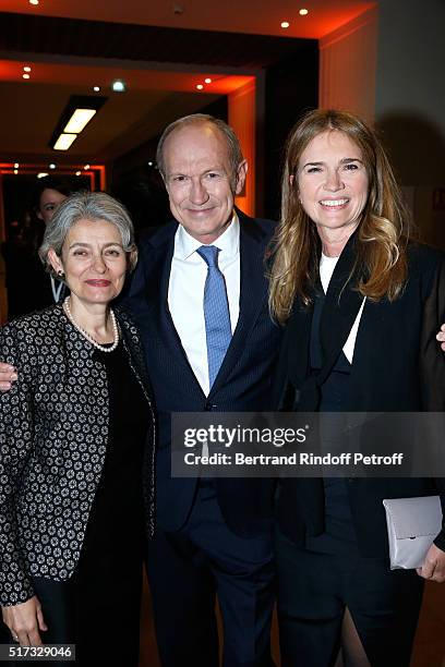 Chairman & Chief Executive Officer of L'Oreal, Chairman of the L'Oreal Foundation Jean-Paul Agon standing between his companion Sophie Agon and...