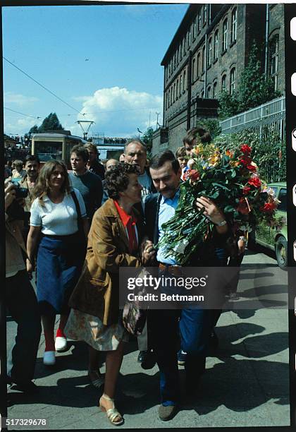 Lech Walesa Celebrates Name Day 6/3/83. He receives flowers on the street.